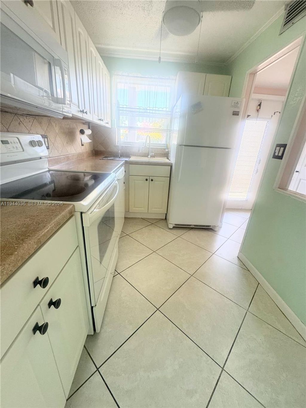 Photo of 8590 Sunrise Lakes Blvd #109, Sunrise, FL 33322 (MLS # A11944036)
