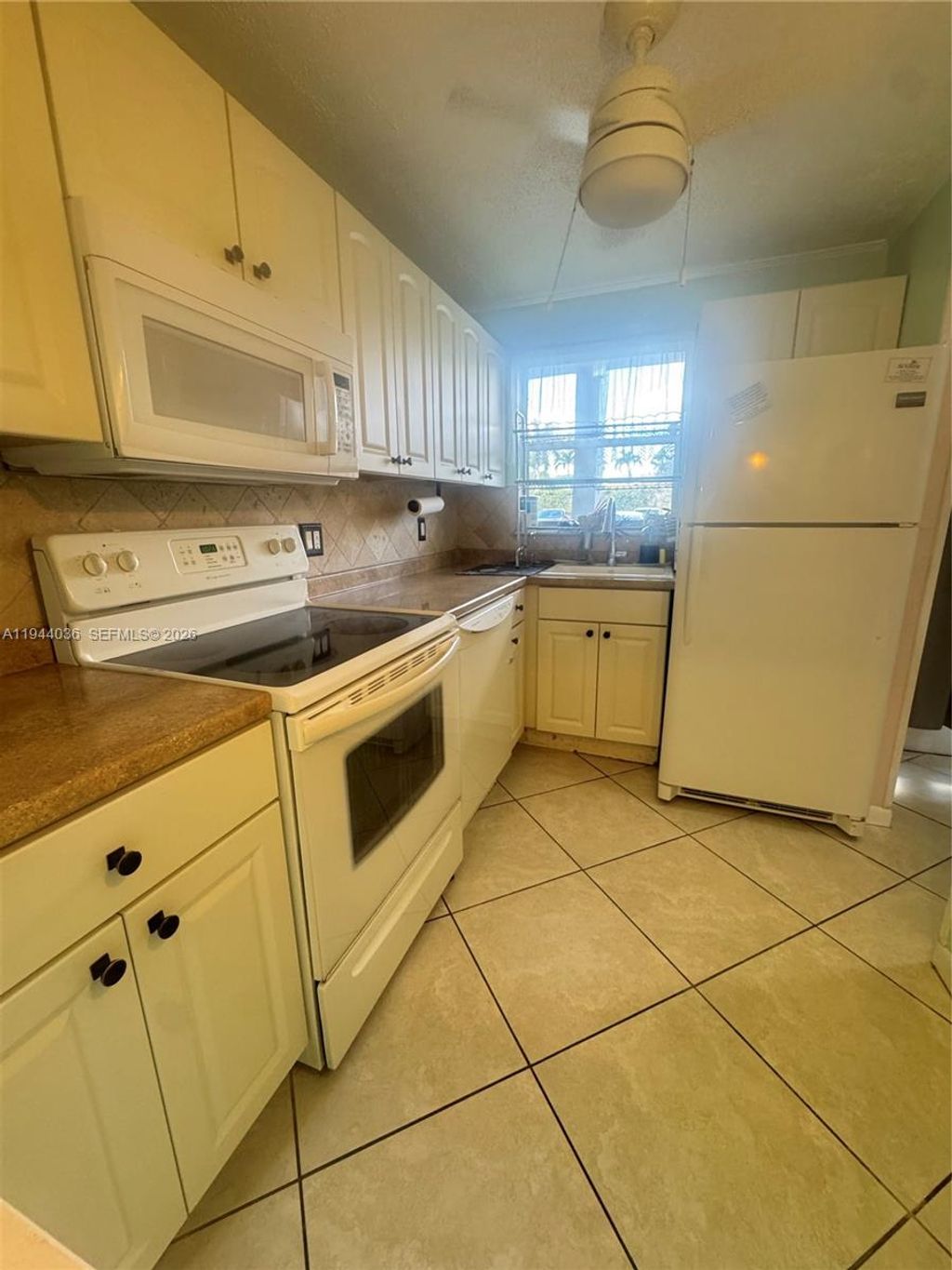 Photo of 8590 Sunrise Lakes Blvd #109, Sunrise, FL 33322 (MLS # A11944036)