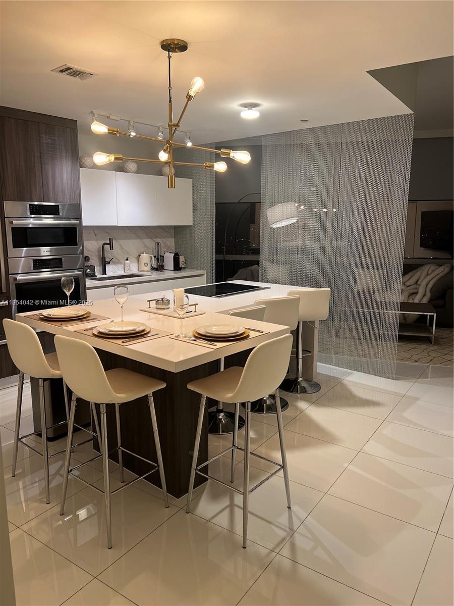 High floor incredible unit serves like 2 bedrooms 2 baths . Fully furnished and equipped.Private elevator.Very bright, a lot of windows, big rooms, custom made closets, custom window treatment, balcony with tile. Beautiful sunsets. Building very known in center of Downtown Miami with all amenities, which you can wish for. Downstairs shops, restaurants, museums, events, sports. Everything is walking distention. Must see!