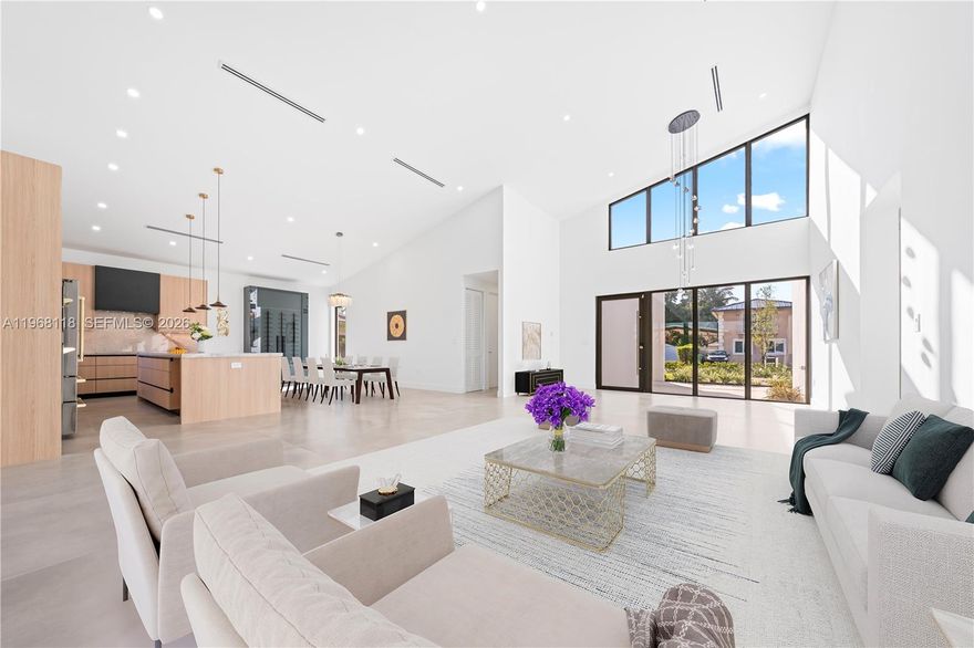 Indulge in elevated modern living within this striking 3,200-square-foot concrete masterpiece, defined by dramatic 22-foot ceilings and architectural sophistication. Thoughtfully designed for both comfort and grandeur, the residence features four generously proportioned bedrooms, three impeccably appointed bathrooms, and expansive living spaces bathed in natural light. At the heart of the home, a chef-inspired gourmet kitchen showcases bespoke wood cabinetry and exquisite Taj Mahal quartz countertops—an artful fusion of refined beauty and enduring performance.
Seamlessly blending indoor and outdoor living, the private terrace reveals a sparkling pool, creating a serene retreat ideal for intimate relaxation or elegant entertaining. A secure garage enhances both convenience and peace of mind. A rare offering that embodies timeless elegance, exceptional craftsmanship, and uncompromising exclusivity.