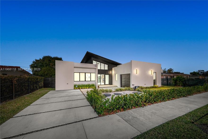 Indulge in elevated modern living within this striking 3,200-square-foot concrete masterpiece, defined by dramatic 22-foot ceilings and architectural sophistication. Thoughtfully designed for both comfort and grandeur, the residence features four generously proportioned bedrooms, three impeccably appointed bathrooms, and expansive living spaces bathed in natural light. At the heart of the home, a chef-inspired gourmet kitchen showcases bespoke wood cabinetry and exquisite Taj Mahal quartz countertops—an artful fusion of refined beauty and enduring performance.
Seamlessly blending indoor and outdoor living, the private terrace reveals a sparkling pool, creating a serene retreat ideal for intimate relaxation or elegant entertaining. A secure garage enhances both convenience and peace of mind. A rare offering that embodies timeless elegance, exceptional craftsmanship, and uncompromising exclusivity.