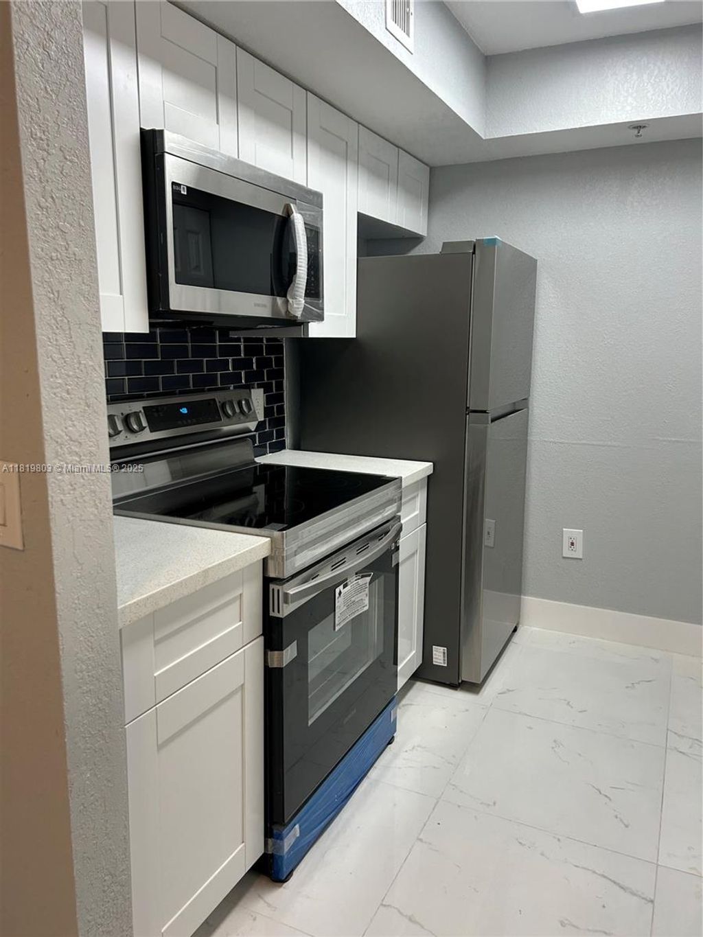 Photo of 2457 Centergate Dr #202, Miramar, FL 33025 (MLS # A11819803)