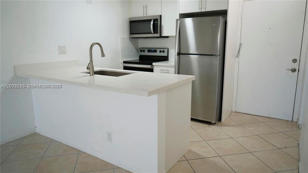Photo of 2771 Riverside Dr #405-A, Coral Springs, FL 33065 (MLS # A12008265)