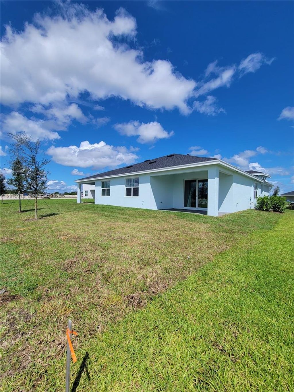 Photo of 1689 Whistlegrass Ln #1689, Loxahatchee, FL 33470 (MLS # A12015316)