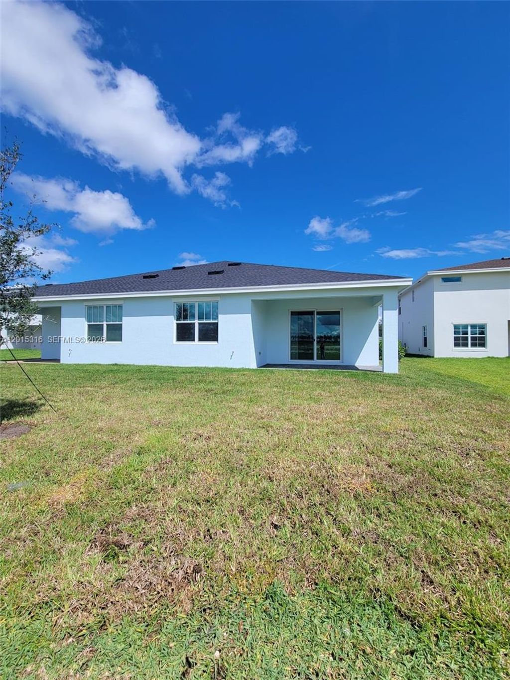 Photo of 1689 Whistlegrass Ln #1689, Loxahatchee, FL 33470 (MLS # A12015316)