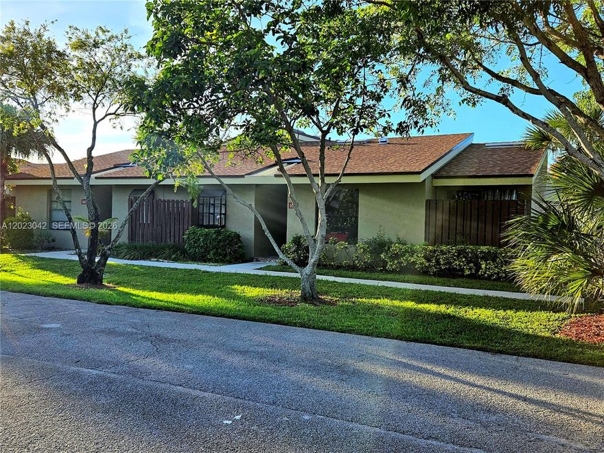 Location, Location! A "Hidden Gem" Ideally situated just 15 minutes from the beach and perfectly nestled between West Palm Beach and Boca Raton, this cozy villa features vaulted ceilings, a spacious laundry room with extra storage, a large primary suite with vaulted ceilings and a spacious walk-in closet. The kitchen is filled with natural warmth featuring golden honey cabinetry and a natural stone backsplash. Enjoy seamless indoor-outdoor living with a large patio accessible from guest bedroom and living room. Enjoy spacious, comfortable living, in a calm, beautiful, maintained community surrounded by lush landscaping and serene green spaces. Willowbrook is an all-ages community offering parks, playgrounds, 2 tennis courts, and 6 pickleball courts.  HOA includes complete roof maintenance and replacement, and the community is finance-friendly with FHA and conventional financing options available with as little as 5% down.