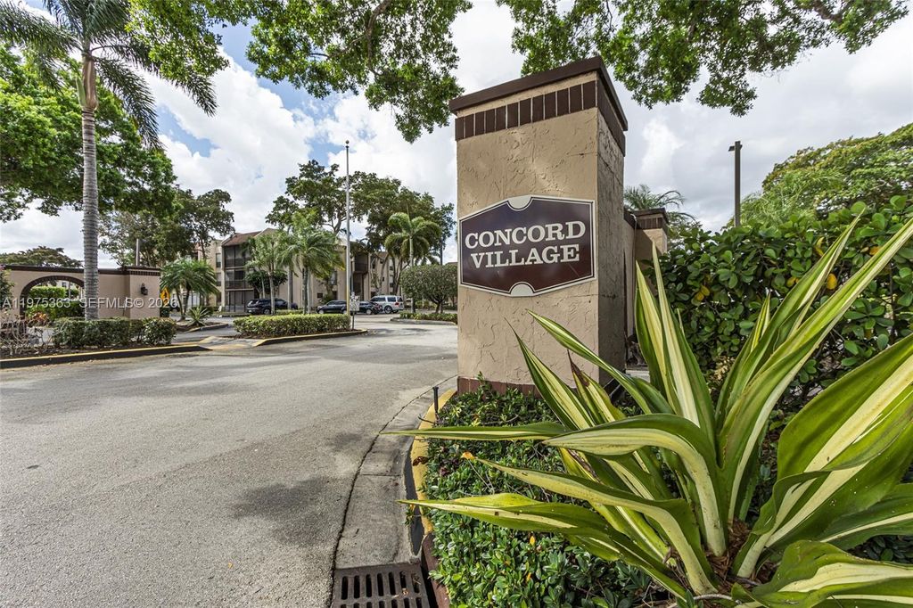 Photo of 6701 N University Dr #210, Tamarac, FL 33321 (MLS # A11975363)