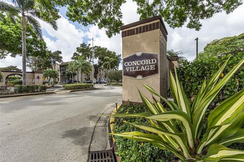 Photo of 6701 N University Dr #210, Tamarac, FL 33321 (MLS # A11975363)