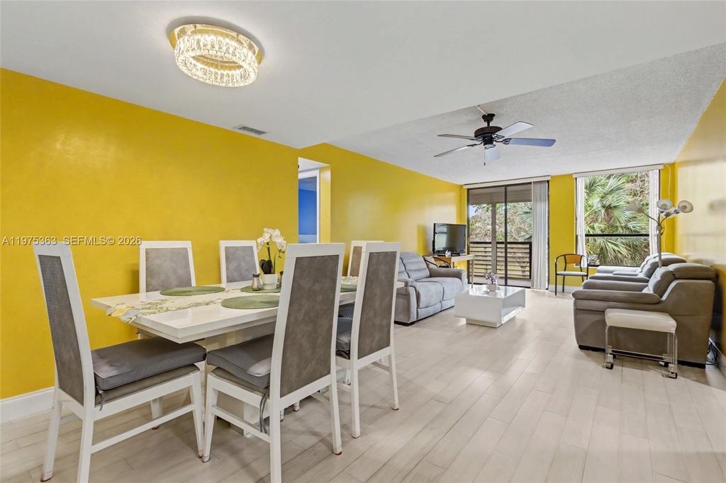 Photo of 6701 N University Dr #210, Tamarac, FL 33321 (MLS # A11975363)