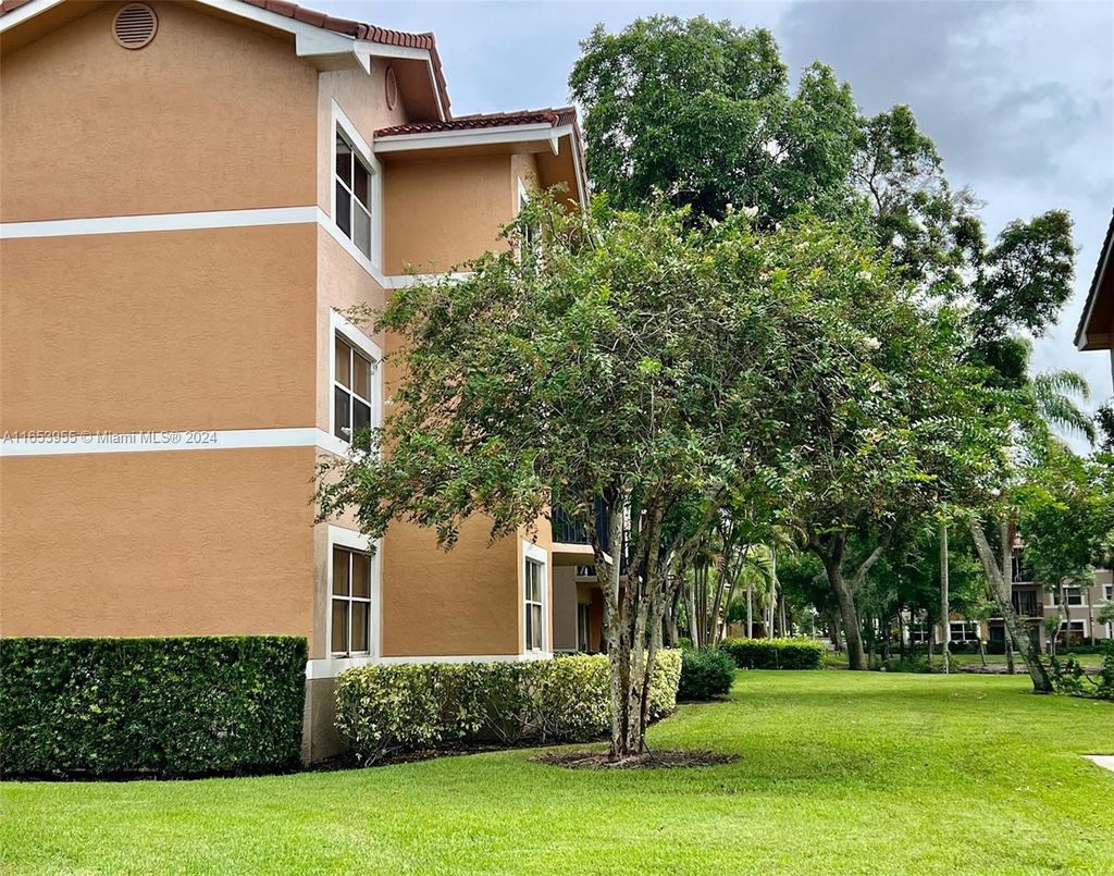 Photo of 8741 Wiles Rd #107, Coral Springs, FL 33067 (MLS # A11653955)