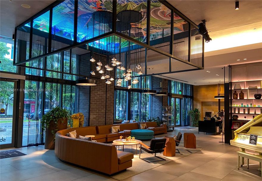 Step into elevated living with this gorgeous 3-bed, 4-bath corner unit boasting over 1,400 sqft of sleek, modern style. Floor-to-ceiling windows fill every room with natural light and frame stunning views of Biscayne Bay. High ceilings add an airy feel, while the contemporary kitchen and spacious bedrooms—each with its own en-suite bath—make everyday life a pleasure. This gem includes a rare assigned parking space and is sold fully furnished and turnkey, so you can move right in or start earning with flexible 30-day rental options. Enjoy resort-style amenities including a spa, pool, gym, tennis court, putting green, and more—all just minutes from Wynwood, the Design District, Miami Beach, and MIA Airport.