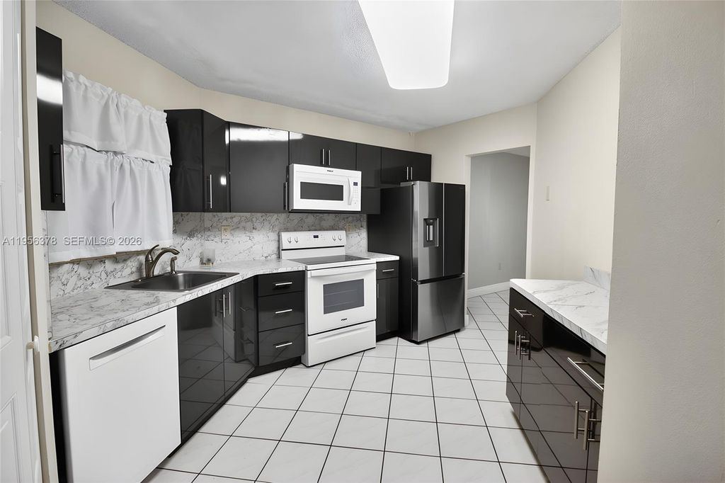 Photo of 6555 W Broward Blvd #303, Plantation, FL 33317 (MLS # A11956378)