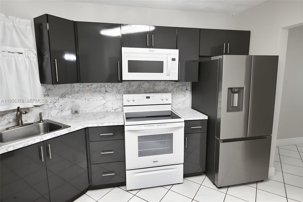 Photo of 6555 W Broward Blvd #303, Plantation, FL 33317 (MLS # A11956378)