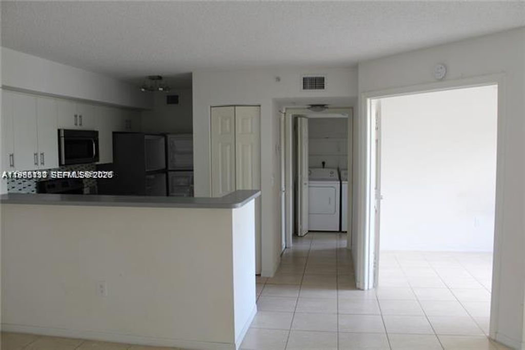 Photo of 11177 SW 8th St #206, Pembroke Pines, FL 33025 (MLS # A11986113)