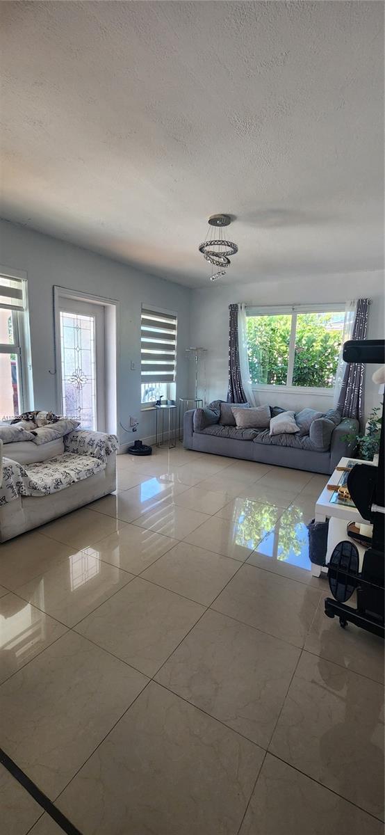 Discover this beautifully remodeled corner-lot home in the heart of Hialeah. Featuring 3/1, the property boasts a new aluminum roof (installed less than 1 year ago) and hurricane-impact windows and doors for enhanced safety and energy efficiency.Enjoy added privacy and curb appeal with a gated entrance leading to a decorative driveway. The spacious corner lot includes a convenient side entrance, perfect for parking a boat, RV, or additional vehicles in the backyard. The city is known for its strong sense of community and municipal support, including a dedicated police department and city-wide emergency preparedness programs. The city has invested significantly in public safety infrastructure, emergency response services, giving homeowners added peace of mind.