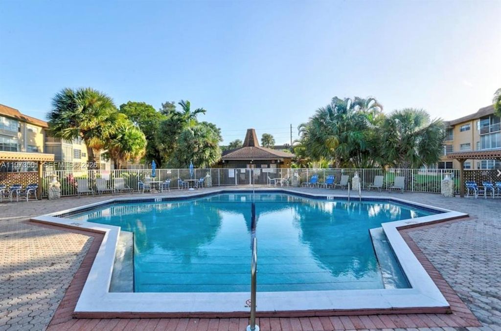 Photo of 5021 W Oakland Park Blvd #104, Lauderdale Lakes, FL 33313 (MLS # A11973501)