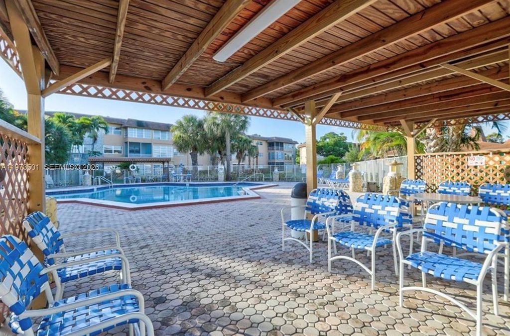 Photo of 5021 W Oakland Park Blvd #104, Lauderdale Lakes, FL 33313 (MLS # A11973501)