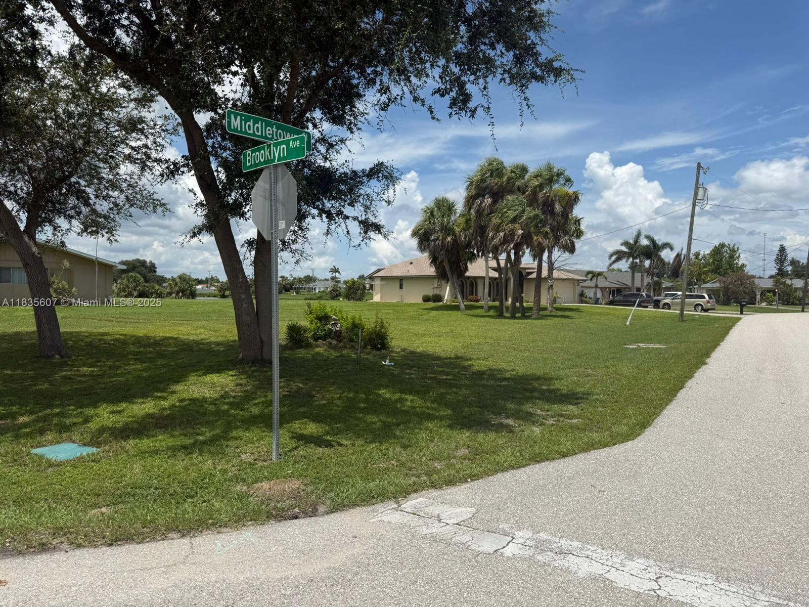Don't miss out on this beautiful WATERVIEW LOT in a great established neighborhood , just waiting for you to build the home of your dreams. This single family CORNER LOT will save you money since it's already CLEARED and they already have a SURVEY, utilities are close by and ready for you to build the home of your dreams right here in sunny paradise! An inviting view of Buffalo Lake will make you not want to look anywhere else! Located in the sought after New York section in Port Charlotte , with public water and sewer available, and NO HOA. Tucked away in a nice neighborhood, yet close to everything - shopping, restaurants, beach complex and Punta Gorda! Thirty minutes to the beautiful Gulf beaches