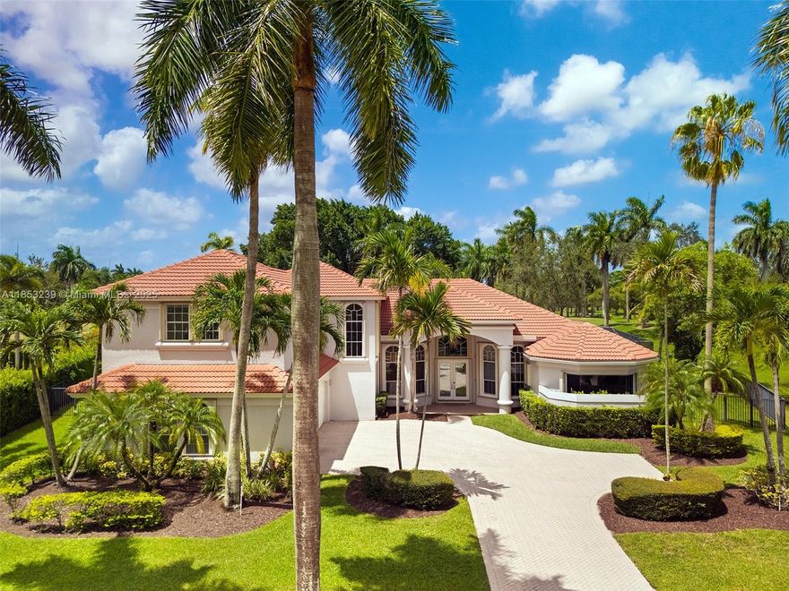 Welcome to Casa Solaris, a stunning custom home in Weston Hills filled w/ natural light, elegant finishes, & custom woodwork throughout. Enjoy golf course views framed by floor-to-ceiling windows & beautifully designed woodwork. Property offers 5 en-suite bedrooms w/ walk-in closets, a spacious office, & oversized clubroom w/ bar & climate-controlled 400-bottle glass wine cellar perfect to entertain. The primary suite offers pool views, a spa-like bath w/ soaking tub under a picture window, & a custom wood entertainment unit w/ vanity. Kitchen features white cabinetry & walk-in pantry. Includes laundry room, 3-car garage, heated saltwater pool w/ new tile & cover, renovated deck, summer kitchen w/ BBQ, 2019 roof, & full water purification + alkaline system. Near A+ schools.
