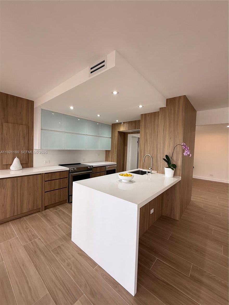 STUNNING completely remodeled, open concept. Modern & bright 2/2 split bedroom with floor to ceiling sliding doors and windows in every room leading to a huge wraparound terrace with Intracoastal view. Access to the balcony from every room. Abundant natural light! New porcelain tile floors throughout. Huge master bathroom with double vessel sinks. Freestanding
bathtub and separate shower. Custom cabinets and wall paneling. Quartz countertops & backsplash. High end appliances. New custom closets throughout! New washer/ dryer and A/C. Electric power hurricane shutters with new motors. NEVER OCCUPIED SINCE RENOVATION, A TRUE TURN KEY, MODERN UNIT!!! Building renovated including balconies. Enjoy "TERRACES LIFESTYLE" in an elegant 5 star building with resort style amenities! Guard gate, 24 hour security & valet, heated pool and spa, towel service, indoor and outdoor cafe's, 2 fitness centers with sauna, tennis courts, pilates classes, racquetball... Situated on Intercoastal Waterway across from Turnberrys World Class Golf course surrounded by a 3.5 Mile jogging Exercise trail. Walking distance to restaurants, shopping, Aventura Mall, Gulfstream & beaches. Vacant, easy to show.