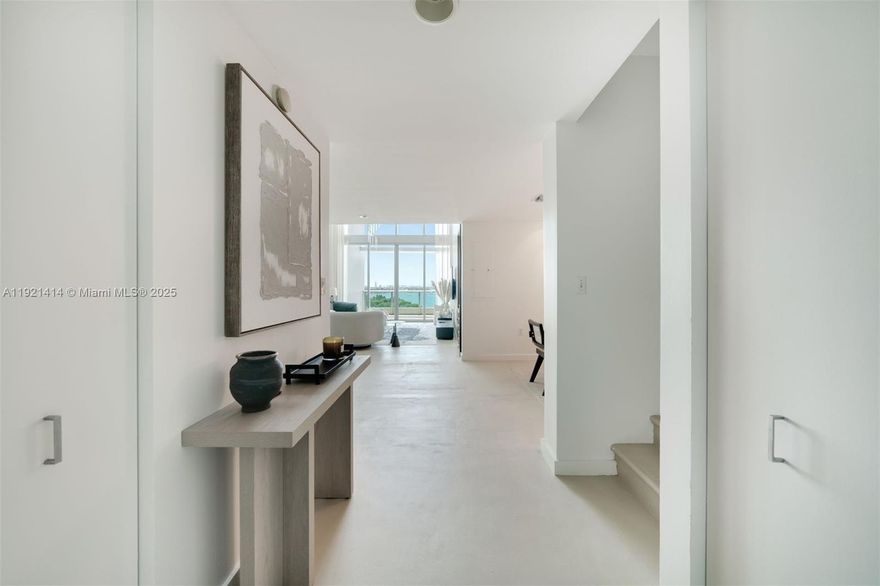 Captivating and Rare Sky-Home in the Heart of Miami! Indulge in the exclusivity of this light-filled two-story condo that present the ultimate in luxury living. This one of a kind unit boasts a  distinctive floorpan with over 1,600 sqft of living space as well as 350qft of terraces over two stories.  With soaring 20ft ceilings and two balconies, this residence bathes in an abundance of natural light, creating an inviting and airy atmosphere. The layout comprises 3 bedrooms, a den, and 3 bathrooms, providing ample space for comfortable living. Enjoy unobstructed water and park views in one of Miami's most iconic buildings 900 Biscayne Bay.