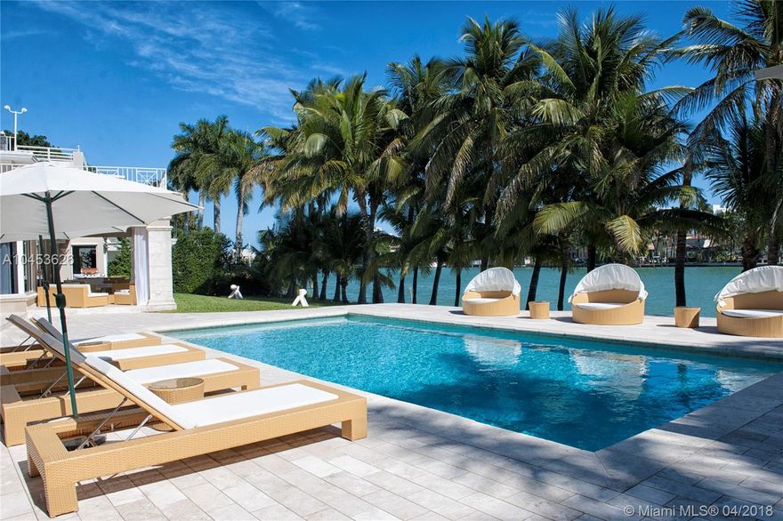 33,000 sq foot lot with 175 Ft of waterfront on the exclusive gated La Gorce Island. The mansion features a sweeping driveway with a stately entrance, luxurious wet bar, gourmet kitchen and built in wine cellar. The master suite occupies the second floor with his and hers bathrooms and office. All bathrooms are equipped with the latest innovation of rain showers and smart toilets. Property features separate guest house. La Gorce Island is guard-gated and patrolled by land and sea 24 hours a day. Excellent property to further renovate or build your dream home