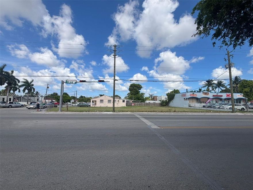 Corner commercial lot (13,800 SF) in Miami-Dade County. High visibility on NW 33rd St with 83+165 ft frontage. Perfect for owner-users or developers seeking infill potential with arterial exposure. Plans for mixed-use with upper residential or office levels possible subject to county approval.