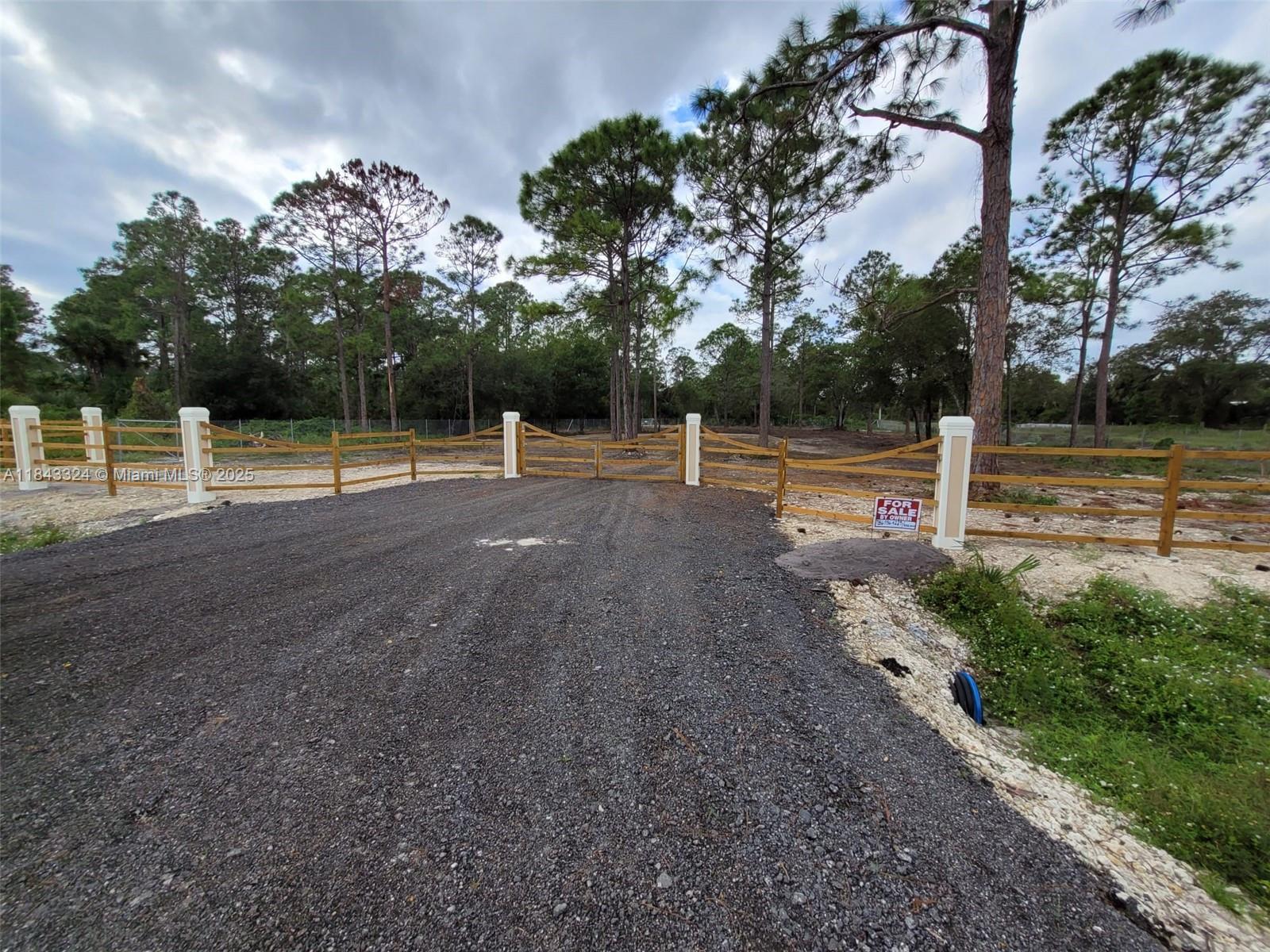 Secure your slice of paradise on this 1.25-acre corner lot in the sought-after Montura Ranches. This lot boasts paved road access and canal frontage—ideal for those seeking ample space, nature, and a slower pace of life. Lot completely cleared and fenced w/ brand new chain-link fence on both sides and rear; a spectacular ranch-type fence and entrance gate complete w/ concrete columns, wood posts and railings. Very large culvert-driveway access from an asphalt road. Plot has been refilled, compacted, and prepared for immediate construction. All construction and improvements thus far have been completed with proper permitting. Unrestricted parking.