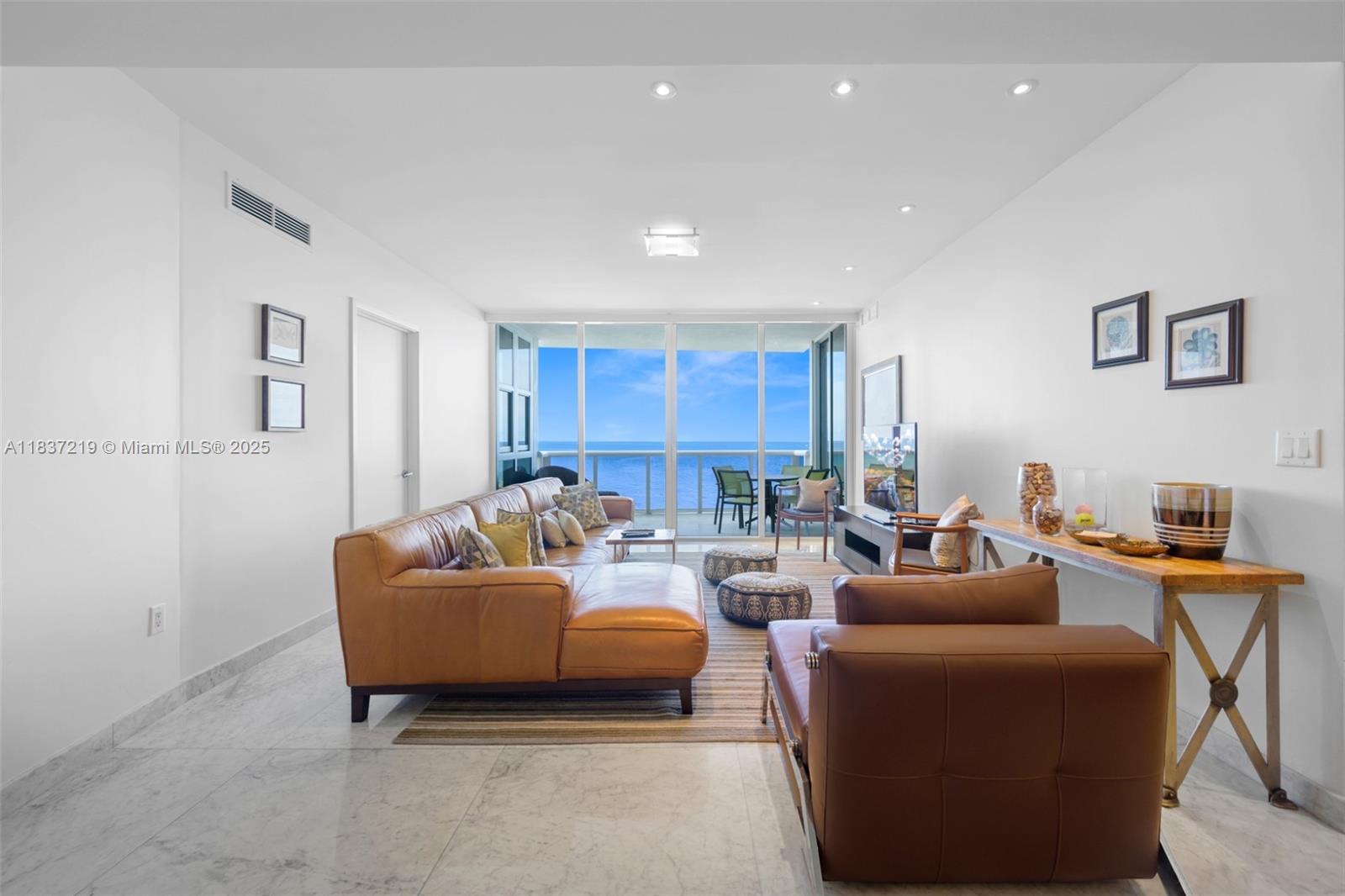 Experience oceanfront luxury in this 3BD/3.5BA condo at Trump Royale, Sunny Isles Beach. Spanning 2,137 SF, this residence features marble and wood floors, a gourmet kitchen with Miele/Sub-Zero appliances, custom cabinetry, and German-designed closets. Automated blinds and floor-to-ceiling windows frame breathtaking ocean views. Enjoy resort-style amenities: valet, fitness center, tennis, spa, pool, on-site dining, and full beach service. Live steps from the sand in a secure, full-service building with global prestige - Ideal as a primary home, vacation retreat, or investment.