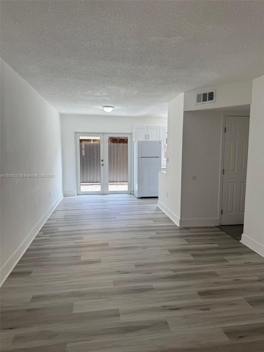 Beautiful, Completely remodeled 3/1.5 bath unit located on the first floor with a fenced patio area. Unit features 2 parking spaces and washer/dryer inside. New floors, new kitchen, new bathrooms. Walking distance to supermarkets, schools, etc.