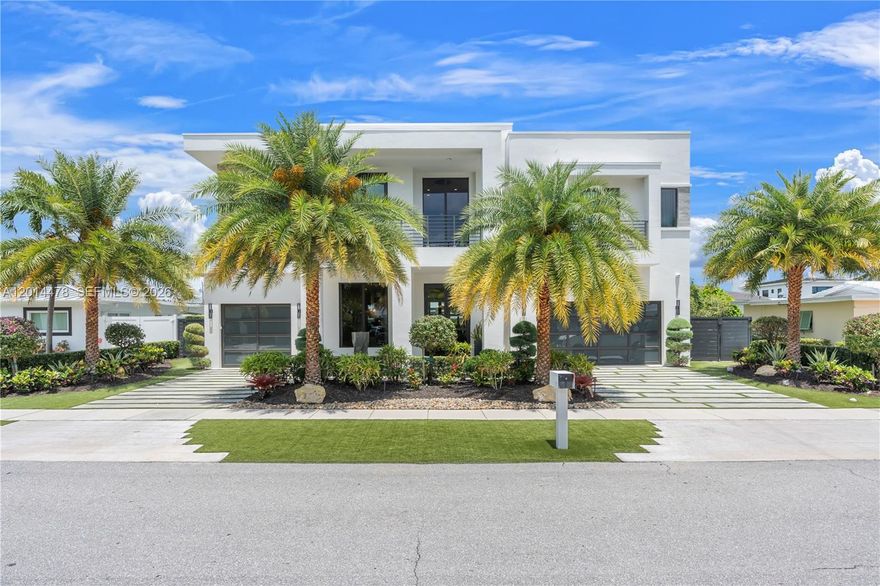 Impeccably renovated waterfront estate offering deepwater ocean access with 80 feet of frontage and no fixed bridges. Custom-designed interiors showcase elevated finishes, tailored millwork, a beautifully renovated primary suite, reimagined bathrooms, and a thoughtfully updated kitchen that connects seamlessly to both interior and exterior living spaces. Resort-style living continues outside with a travertine pool deck, a motorized louvered pergola, and a fully appointed outdoor kitchen. Additional highlights include a whole-house generator, outfitted garage with slatwall storage, and porcelain exterior wall cladding. Prime East Boca Raton location with access to acclaimed restaurants, shopping, and entertainment in Boca, Delray Beach, West Palm & Palm Beach.