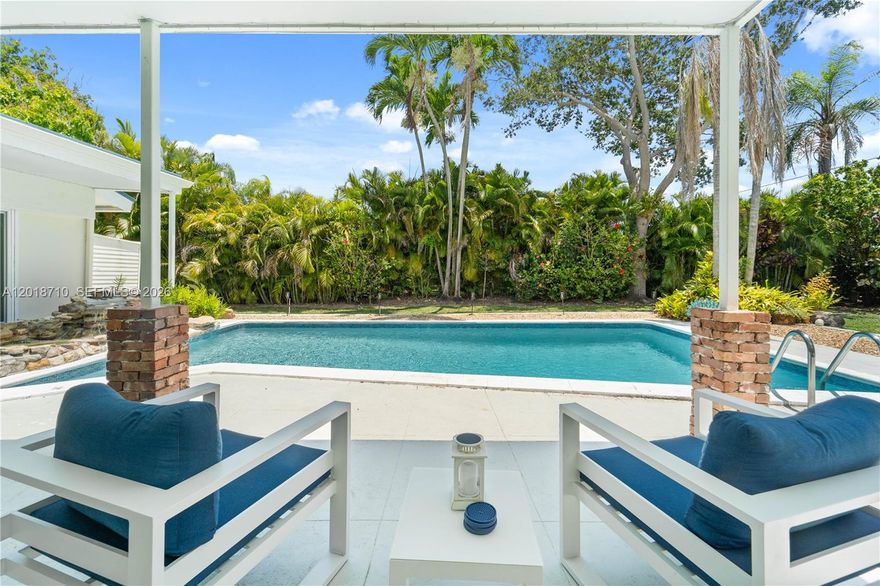 Experience refined living in this exceptional residence in Cutler Bay, gracefully positioned near a quiet cul-de-sac on an impressive 17,160-square-foot lot. Thoughtfully curated with sophisticated finishes and timeless design elements, this home offers an unparalleled blend of comfort and elegance.
The heart of the home is a beautifully appointed chef’s kitchen featuring quartz countertops, premium stainless steel appliances, and seamless flow into the expansive living spaces. Dramatic wood-beam ceilings soar above the main living area, while designer lighting and a well-conceived floor plan create an atmosphere that is both inviting and elevated.
Step outside into your own private oasis, where lush tropical landscaping surrounds a sparkling pool designed for effortless entertaining and serene outdoor living. Recent enhancements include a sleek aluminum roof installed approximately three years ago, as well as imported Chicago brick detailing that adds character and distinction to both the front and rear exterior spaces.
Ideally located near Palmer Trinity School and moments from Old Cutler Road, this remarkable property offers convenience, prestige, and privacy — all without the constraints of a homeowner’s association.
A rare offering that captures the essence of South Florida luxury living. Private showings available by