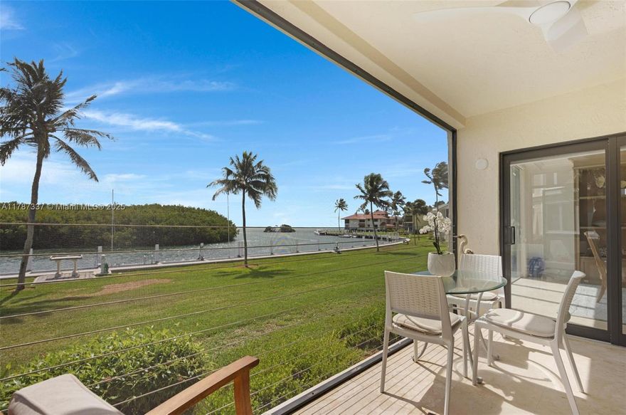 Beautifully renovated 4BR/3.5BA ground-floor condo in the exclusive Ocean Reef Club. This spacious residence features an open-concept layout, a modern kitchen remodeled in 2021 with granite countertops, stainless steel appliances, and custom cabinetry. Enjoy impact windows and doors, a new roof (2024), a screened-in porch, and a mirrored living room wall reflecting natural light and expansive water views. The bar area includes a Scotsman ice maker and a wine/beverage fridge. One bedroom offers flexible use as a dining room or guest suite with a Murphy bed. Includes 29' of assigned dockage in a protected canal with direct ocean access. Offered fully furnished with golf cart storage. Move-in ready. Live the luxury waterfront lifestyle at Ocean Reef Club.