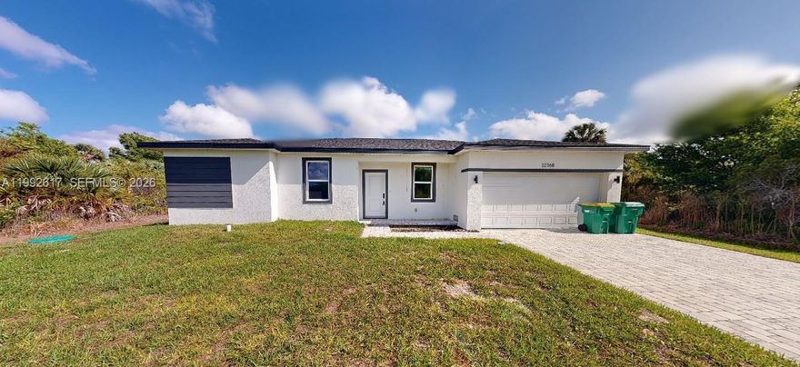 Major reduction for fast sale. Act now. Experience modern Florida living in this brand-new construction 4-bedroom, 2-bath home in Port Charlotte with no HOA, no CDD, and no rental restrictions. Designed for style and efficiency, this open-concept layout features a spacious great room, dining area, and a stunning kitchen with 42" upper cabinets, quartz countertops, an island, and stainless-steel appliances. Enjoy luxury waterproof vinyl plank flooring throughout. In the master bedroom, there is a fully tiled walk-in shower, a private owner’s suite with dual sinks, and a large walk-in closet. The split floor plan offers privacy for guests or family, with additional three bedrooms and a second full bathroom, which also includes fully tiled shower and tub surrounds. Built with energy-smart features including Low-E windows, high-efficiency mechanicals, a water treatment system, and low-flow fixtures, this home helps keep utility costs low. Additional highlights include a paver driveway, a 2-car garage, and an interior laundry room. Located just minutes from beaches, shopping, dining, and I-75, this home offers the perfect mix of comfort, freedom, and value—without the builder markup. Move-in ready and packed with upgrades—don’t miss it! See Virtual Tour Link attached!