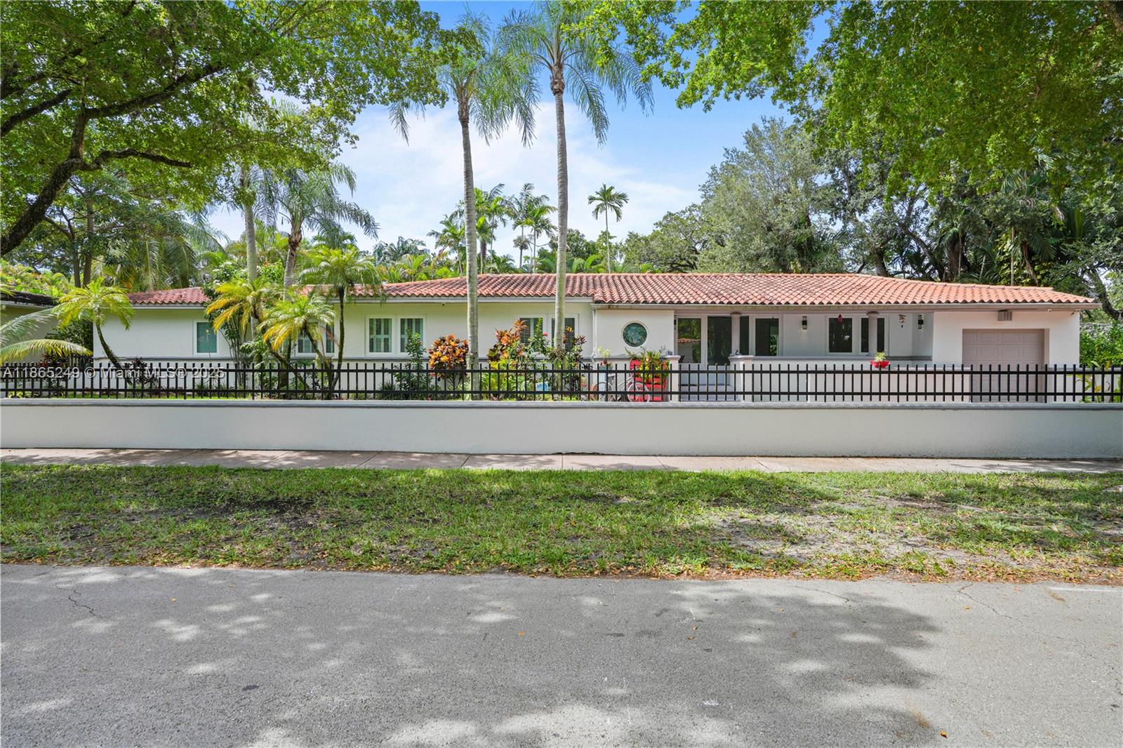Discover timeless Coral Gables elegance in this updated 4BR/3BA Riviera home on a lush 13,000 SF lot. Bright, open interiors with vaulted ceilings, hardwood floors, impact windows, and a decorative fireplace create warmth and charm. The gourmet Miele kitchen with custom cabinetry and breakfast nook flows seamlessly into versatile living spaces, including a serene master suite with California closets, spa-like bath, and pool and garden views. Modern touches include Sonos audio, Culligan water filtration, and keyless entry. Outdoors, enjoy a private oasis with pool/spa, pergola, and full summer kitchen—perfect for entertaining. Gated driveway, garage with EV charger, and prime location near UM, Riviera Golf Club, Merrick Park, and top-rated schools make this a rare Coral Gables offering.