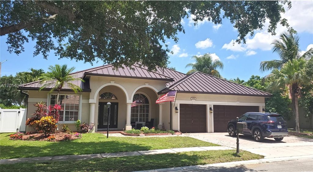 Photo of 2051 NW 125th Ter, Pembroke Pines, FL 33028 (MLS # A12014089)