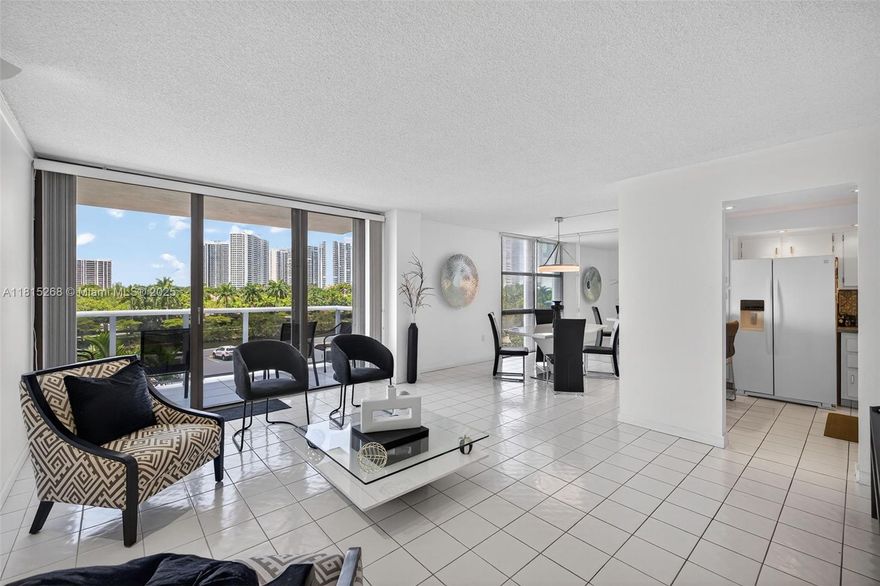 WOW!  FANTASTIC SPACIOUS CONTEMPORARY & PRISTINE RESIDENCE. LOCATED ON COVETED COUNTRY CLUB DR IN THE HEART OF AVENTURA ACROSS FROM TURNBERRY GOLF COURSE. THIS LARGEST 1 BEDROOM & 1.5 BATH. EASILY CONVERTS TO 2 BEDROOM. BOASTS OF INTRACOASTAL  VIEWS FROM FLOOR TO CEILING WINDOWS & GLASS TERRACE W/ HURRICANE SHUTTERS WATER VIEWS CAN BE SEEN THROUGHOUT, OPEN UPDATED KITCHEN, ALL WHITE & GREY TILE FLOORS THROUGHOUT, FINEST FIXTURES INCLUDE NEW MODERN LIGHT FIXTURES. WHITE CABINETS, METALLIC BACKSPLASH & MORE,FURNITURE NEGOTIABLE, A GEM. BUILDING IS REMODELED AND IT FEATURES A JUST REFINISHED OLYMPIC SIZE POOL, STEAM AND SAUNA, PICNIC AND SUMMER KITCHEN AREA ALONG THE INTRACOASTAL, KIDS AREA, GYM AND RECREATIONAL ROOM, BILLIARD ROOM, 24 HOUR SECURITY WITH LOBBY ATTENDANT.