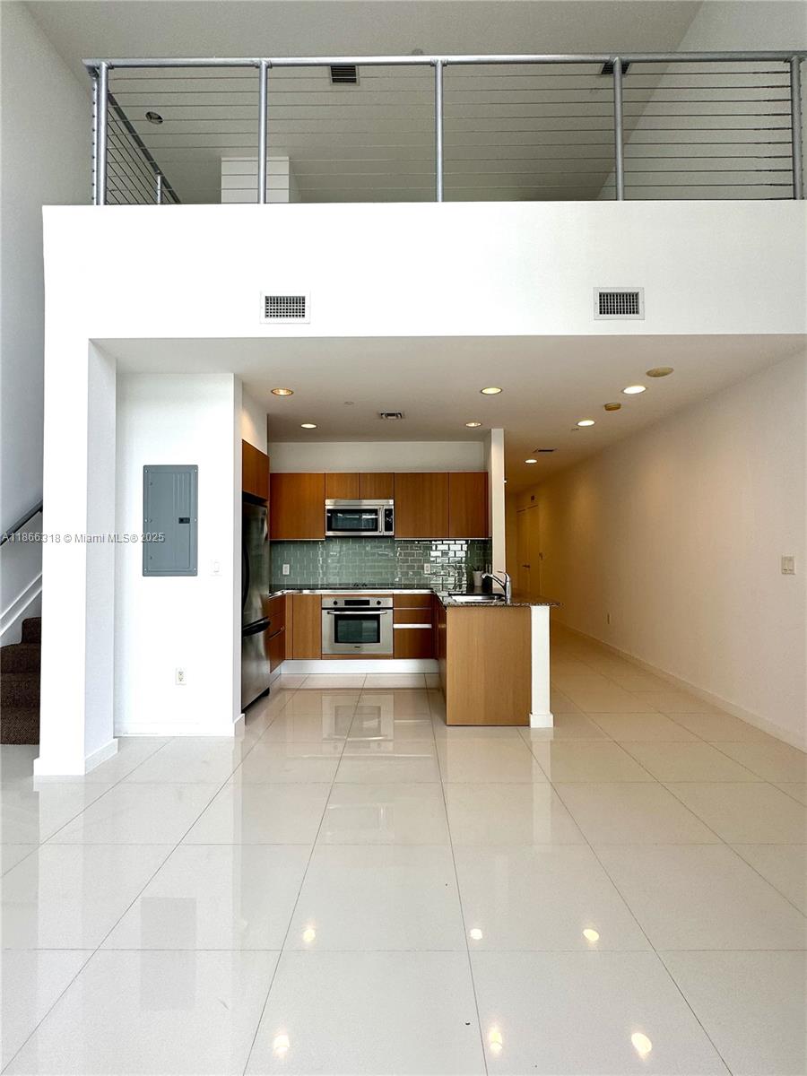 HOME SWEET HOME! Stunning lower penthouse loft on the 34th floor with floor-to-ceiling windows facing west for gorgeous sunset views over Mary Brickell Village. This spacious 1 bed, 1.5 bath unit (1,128 SQFT) is one of the largest in the building, featuring marble floors, open kitchen with stainless steel appliances, ample closets, washer/dryer, and a private balcony. Luxury amenities include 24-hr valet, security, fitness center, pool, jacuzzi, concierge, onsite restaurant, locksmith & dental office. Walk to Brickell City Centre, Sexy Fish, Komodo & more. 1 parking space + guest parking. 12-month lease. Move-in ready!