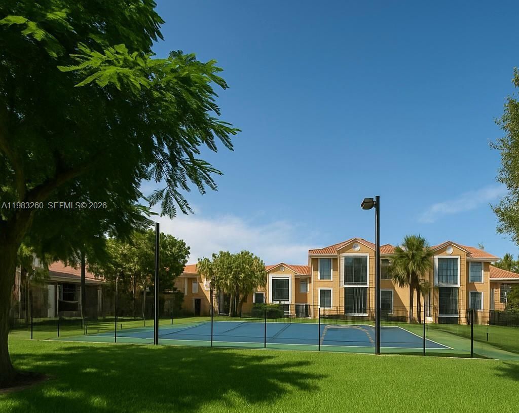 Photo of 7940 N Nob Hill Rd #102, Tamarac, FL 33321 (MLS # A11983260)