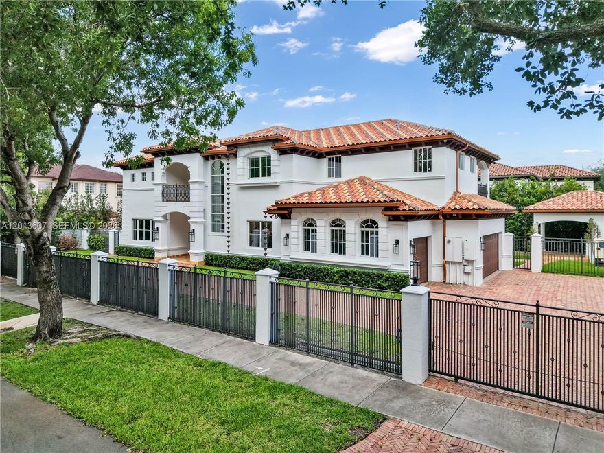 Private & Gated 5 Bed / 6.5 Bath Estate located within the prestigious Royal Oaks community of Miami Lakes. Situated on over a quarter-acre across two lots, this exceptional residence offers an ideal blend of luxury, comfort, and scale. Featuring soaring volume ceilings, expansive living spaces, and abundant natural light throughout, the home is enhanced by marble flooring, custom travertine bathrooms, plantation shutters, and a spacious eat-in kitchen with granite countertops and breakfast nook. The oversized primary suite features its own private covered terrace, while a desirable first-floor secondary suite offers a dedicated covered patio—ideal for guests or multigenerational living. Additional highlights include a whole-home generator, 3-car garage, elegant copper gutters, and an oversized Chicago brick-paved driveway. Step outside to a resort-style backyard complete with a large pool area, detached outdoor kitchen-pavilion, and cabana bath designed for seamless entertaining. Centrally located with convenient access to both Miami and Fort Lauderdale, and No HOA.