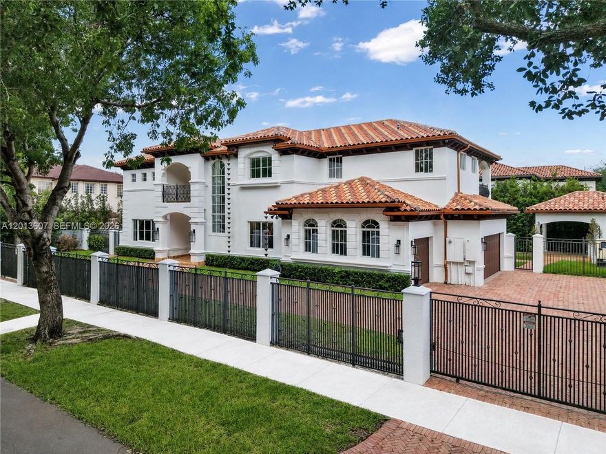 Private & Gated 5 Bed / 6.5 Bath Estate located within the prestigious Royal Oaks community of Miami Lakes. Situated on over a quarter-acre across two lots, this exceptional residence offers an ideal blend of luxury, comfort, and scale. Featuring soaring volume ceilings, expansive living spaces, and abundant natural light throughout, the home is enhanced by marble flooring, custom travertine bathrooms, plantation shutters, and a spacious eat-in kitchen with granite countertops and breakfast nook. The oversized primary suite features its own private covered terrace, while a desirable first-floor secondary suite offers a dedicated covered patio—ideal for guests or multigenerational living. Additional highlights include a whole-home generator, 3-car garage, elegant copper gutters, and an oversized Chicago brick-paved driveway. Step outside to a resort-style backyard complete with a large pool area, detached outdoor kitchen-pavilion, and cabana bath designed for seamless entertaining. Centrally located with convenient access to both Miami and Fort Lauderdale, and No HOA.