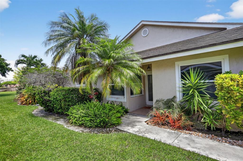 Photo of 1245 NW 52nd Way, Deerfield Beach, FL 33442 (MLS # A11844004)