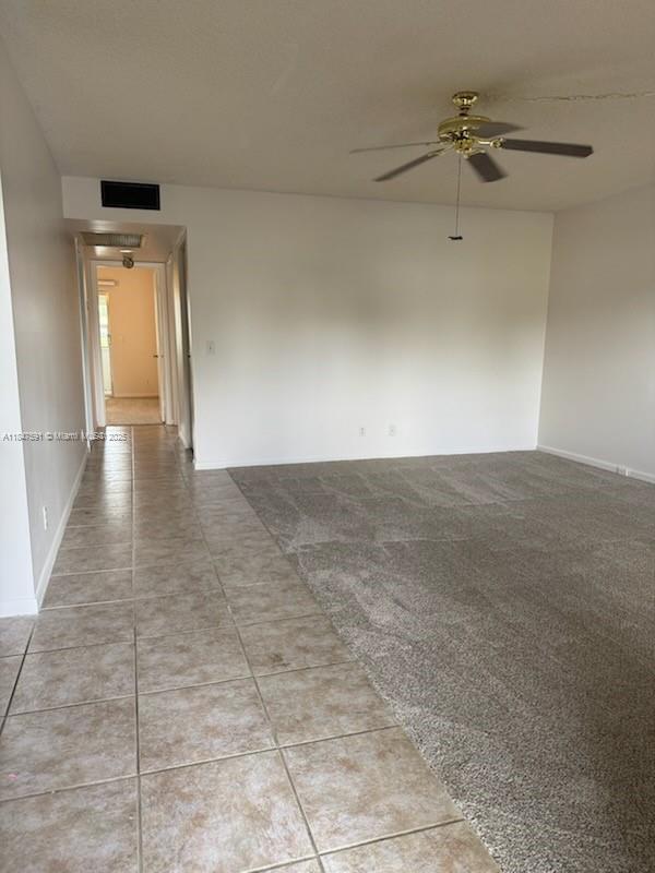Amazing first floor 2/2 condo in Century Village! Your parking space is right in front of this beautiful unit. It is truly in move-in condition and has just been freshly painted. The kitchen has been updated with newer stainless steel appliances, cabinets, and countertops. The AC is only one-year new and still under warranty. There is ceramic tile in all high traffic areas and brand new carpet in the living room and both bedrooms. The second bathroom has been updated, and the master bathroom and bedroom have wide doors that can accommodate a wheelchair. The enclosed back patio overlooks a peaceful lake, and the master bedroom has a walk-in closet. It is close to the main entrance, the multi-million $ clubhouse, on-site pharmacy, and place of worship. **EZ show -- click Show Assist**