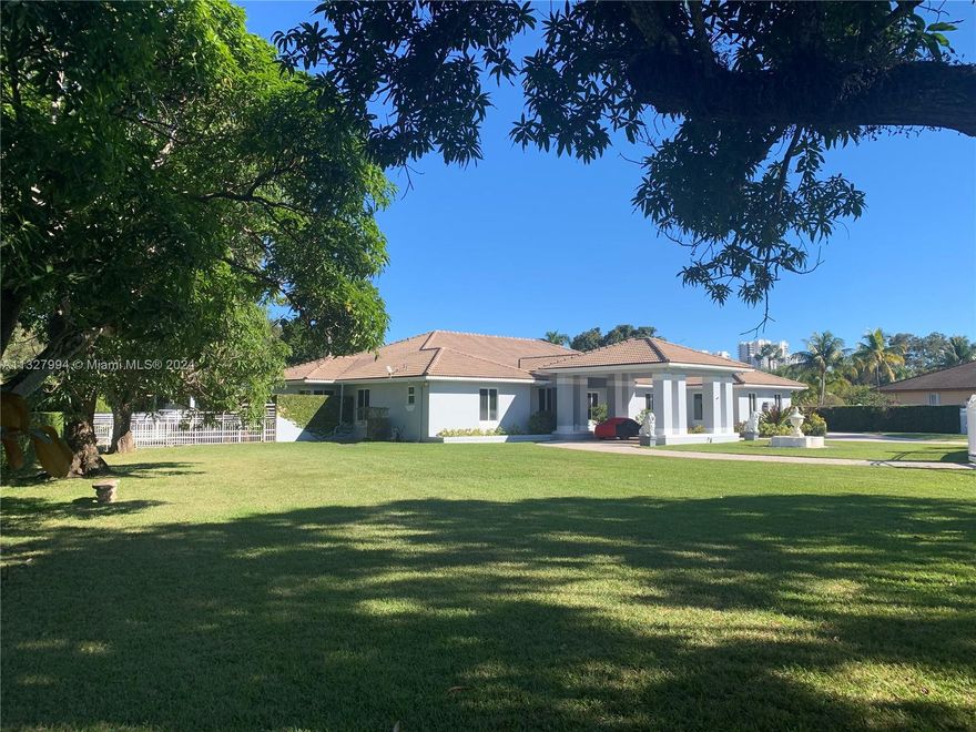 NEW ROOF 2024. On a builder's acre. 4,785 liv sq ft/6,280 under roof(appraiser sketch). Only home at end of  cul-de-sac/1 of 4 on the block, walled/2 gates, 4-zone A/C(2015-22) painted in '22, complete marble floor('13)NEW kitchen/Miele('13), complete impact windows/doors/solar reflective('21), 36kw Generac quiet generator/1,000 gallon tank('14), volume ceilings, '44 heated lap pool/pool deck('14), summer kitchen w/Viking stove('16) 2-car garage, car port, plus awning car port, no hurricane evac. for cat 1-3/'95 post Andrew build code, not in flood zone, close to 3 highways, high rated schools. Attic storage, LED lights('15), bath(2013). Ca.closets('12), tank/tankless water heaters. 3 spas. Exer./Game room. Formal liv./din.rooms. Fruit trees. NO HOA(ALSO LISTED FOR​​‌​​​​‌​‌​​​‌‌​​​‌‌‌​​‌​​‌‌​​​​ RENT)