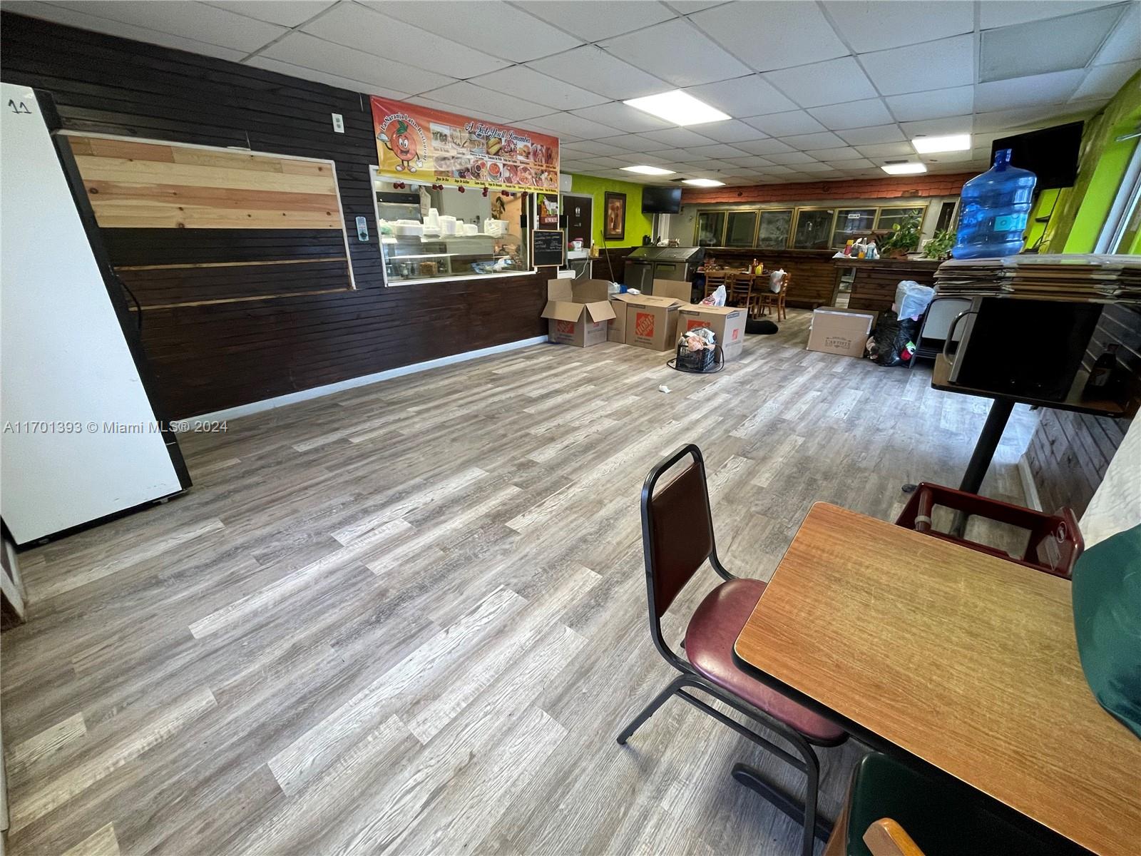 This property offers 1.15 general commercial land with ample space to construct additional buildings. The existing 1960 sq. ft. restaurant, featuring a full kitchen, bar, and large freezer, can be easily transformed to fit various business needs. It is an ideal location for a convenience store, farmers market, gas station, or storage facility. The area is in demand for a farmers market, especially with ongoing residential developments and the upcoming expansion of Orange Avenue. The property includes an industrial water system
