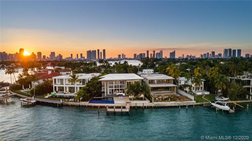 Architectural modern masterpiece and one-of-a-kind work of art on coveted Venetian Islands! The art connoisseur, interior design lover,and future owner will revel in this fully custom awe inspiring home.Boasting expansive Biscayne Bay waterfront views, soaring ceilings mixed w/cantilevered concrete & voluminous glass, floating sculpture staircase w/illuminated black quartz, unique 19ft NOA rated entry door never again replicated and interior tropical garden w/sustained irrigation system. Chef inspired enormous tailor made Snaidero kitchen & bar w/temp controlled glass wine room is an entertainers dream! In addition, each of the 5 bedrooms have en suite baths & fully built out custom closets, 2 separate family rooms w/incredible views, commercial grade elevator, and 3 car collectors garage