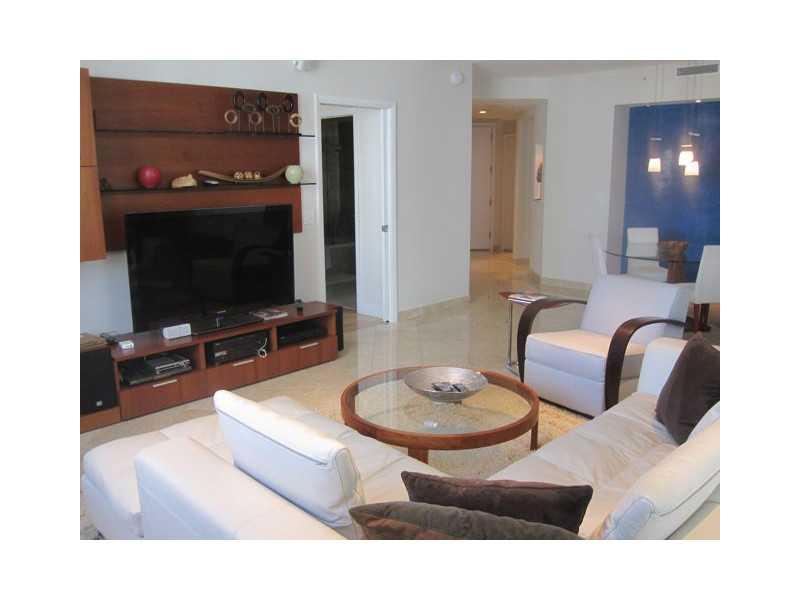 Professionally decorated corner unit with lots of upgrades and fixtures.including marble and wood floors; California walk-in closets; built-in lighting fixtures; integrated sound system throughout apartment; large storage bin; two assigned parking spaces; stunning view of Biscayne Bay. all this in one of the best-managed buildings in all of Brickell. This is the most desirable line in the bldg. Superior resident services by highly trained staff; excellent Financial condition; Lots of modern amenities.