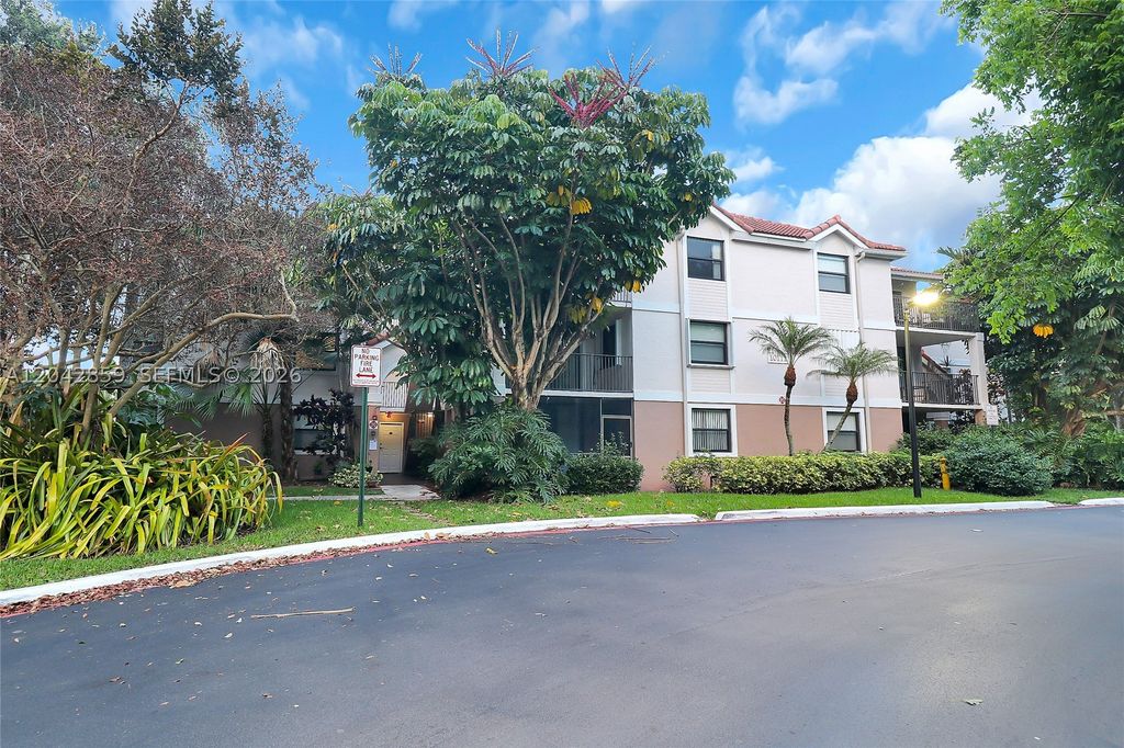 Photo of 10111 W Sunrise Blvd #303, Plantation, FL 33322 (MLS # A12042859)