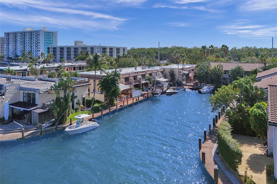 Gorgeous WATERFRONT Townhome. Property being leased fully furnished - gorgeous modern furniture and decor! Located in Western Eastern Shores, Leeward Point, a serene waterfront community. This exceptional property combines elegance and functionality offering the ultimate coastal lifestyle.   Bright and Spacious Living Spaces. Fabulous tile floors thru out. Gorgeous Kitchen and bathrooms! Tastefully designed with stylish finishes and an inviting atmosphere. Amenities include - Rare to find Tennis Courts - Fabulous Resort style heated Salt water pool - gorgeous club house that has been completely remodeled. Renovated Gym. Community is in process of replacing roofs - the project is almost complete!