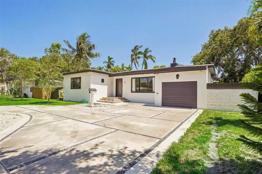 Welcome to your dream home in Miami Shores! This stunning single family home boasts 3 spacious bedrooms, 2 luxurious bathrooms, and a beautifully updated kitchen with granite counters and stainless-steel appliances. The new roof provides peace of mind for years to come, while the central location offers convenience and easy access to all that Miami has to offer. Newley fenced backyard with ample space for a boat, RV, or even a pool, this property is perfect for those who love to entertain or simply enjoy outdoor living. Brand new modern driveway to fit all your family's cars. Don't miss out on the opportunity to make this house your forever home in the vibrant and sought-after community of Miami Shores. Live the Florida lifestyle you've always dreamed of in this picture-perfect residence.